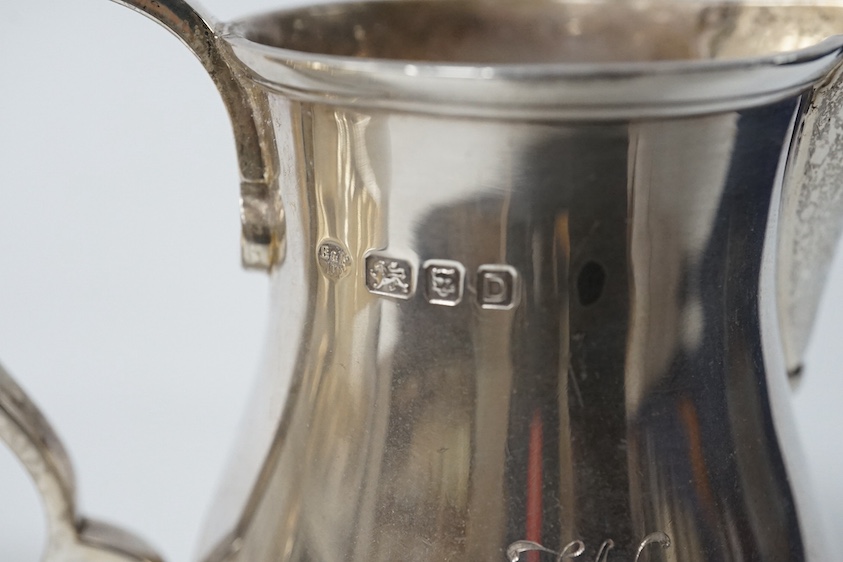 A George VI silver cream jug and sugar bowl by Blackmore & Fletcher Ltd, London, 1939, jug 10.9cm, 11.9oz, with engraved inscription. Condition - fair to good